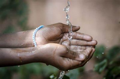 Hands cupped collecting water